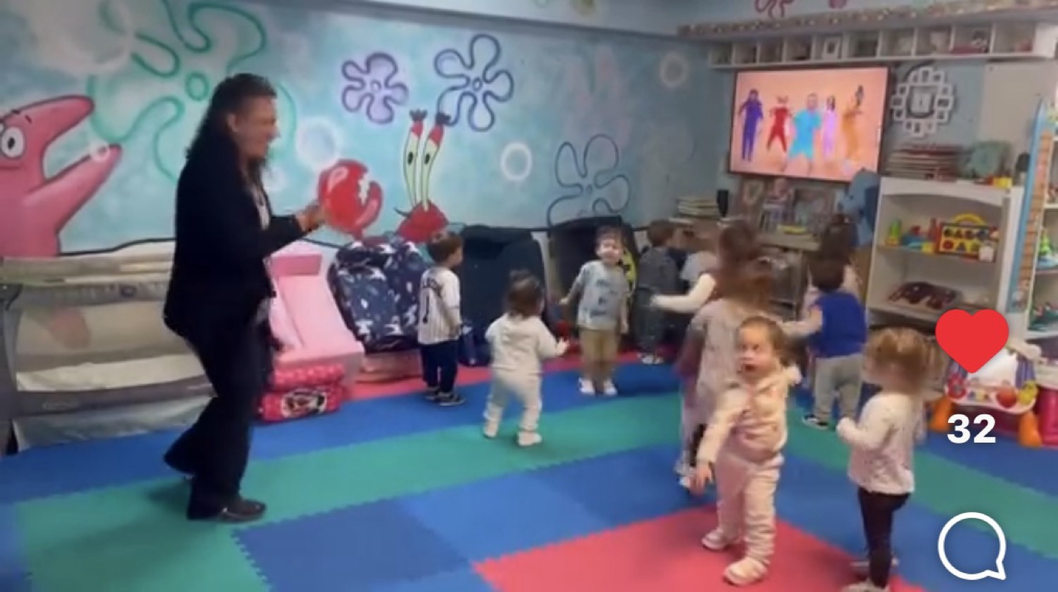 Children dancing in the playroom at My Piccolo Mondo