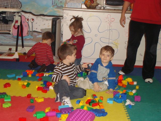 Child painting at My Piccolo Mondo preschool preparation program